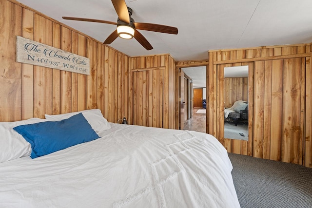 N4823 Peppler Ln, Wild Rose, WI 54984 - bedroom featuring wooden walls, carpet flooring, and ceiling fan