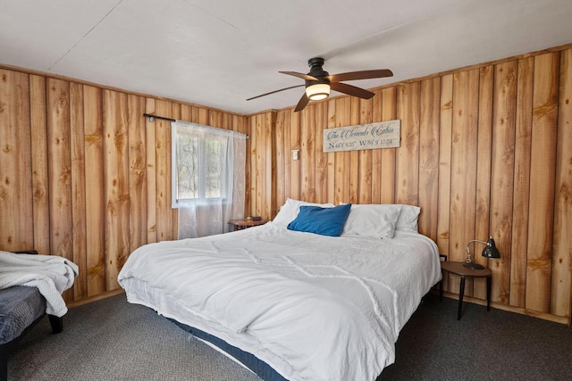 N4823 Peppler Ln, Wild Rose, WI 54984 - carpeted bedroom featuring wood walls and a ceiling fan