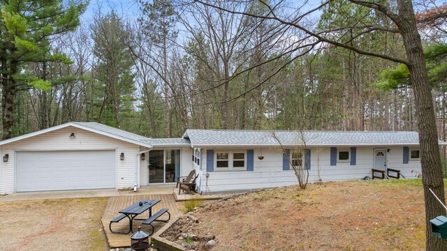 N4823 Peppler Ln, Wild Rose, WI 54984 - ranch-style home featuring a garage, driveway, and roof with shingles