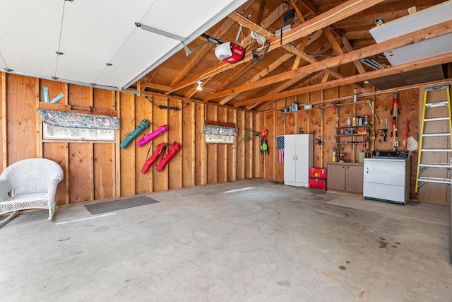 N4823 Peppler Ln, Wild Rose, WI 54984 - garage featuring a garage door opener and washer / clothes dryer