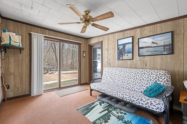 N4823 Peppler Ln, Wild Rose, WI 54984 - living area with wood walls, carpet, ceiling fan, and ornamental molding