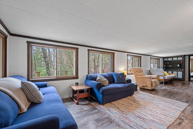 N4823 Peppler Ln, Wild Rose, WI 54984 - living area with wood finished floors, a healthy amount of sunlight, and crown molding