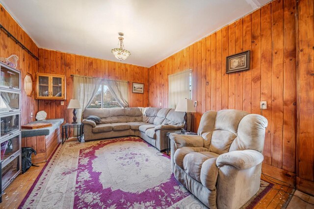 607 Jefferson Ave, Omro, WI 54963 - living room featuring hardwood / wood-style floors and wood walls