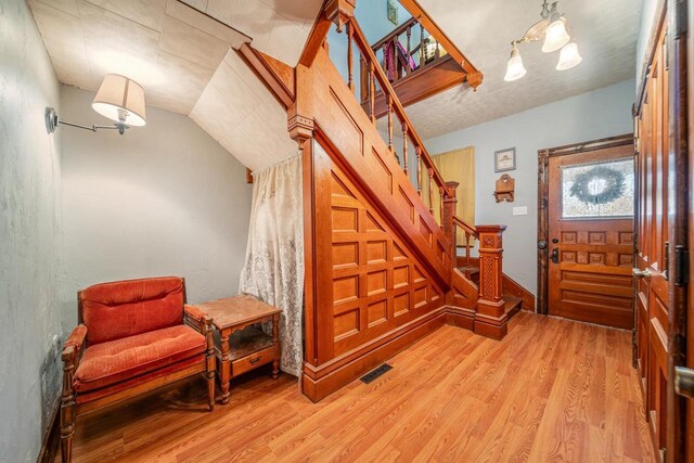 607 Jefferson Ave, Omro, WI 54963 - entrance foyer with light wood finished floors, visible vents, and stairs