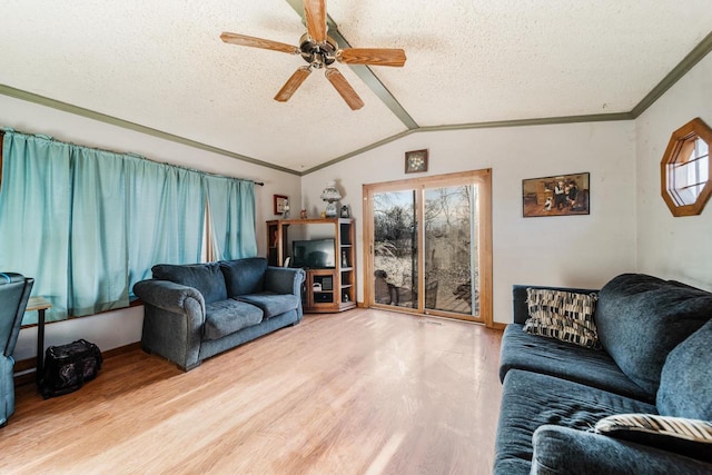 607 Jefferson Ave, Omro, WI 54963 - living area with crown molding, wood finished floors, a textured ceiling, ceiling fan, and lofted ceiling