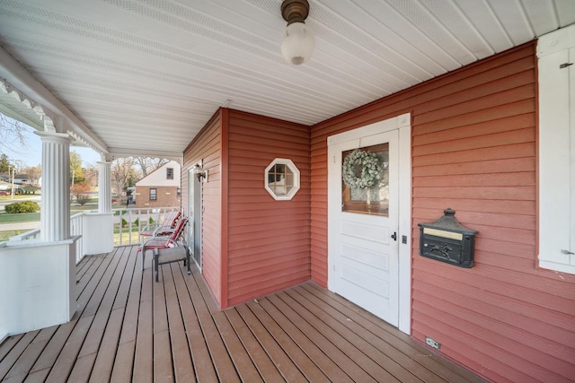 607 Jefferson Ave, Omro, WI 54963 - wooden terrace with a porch