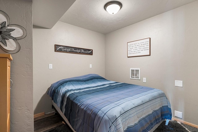 bedroom featuring visible vents and baseboards