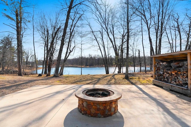 view of patio with a water view