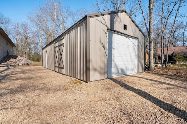 detached garage featuring driveway
