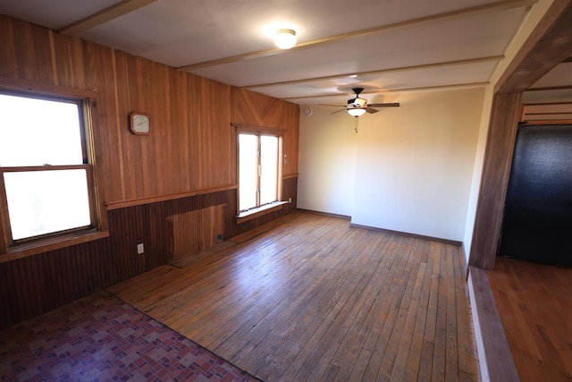 50220 Turkey Ridge Rd, Gays Mills, WI 54631 - spare room with hardwood / wood-style floors, wood walls, and ceiling fan