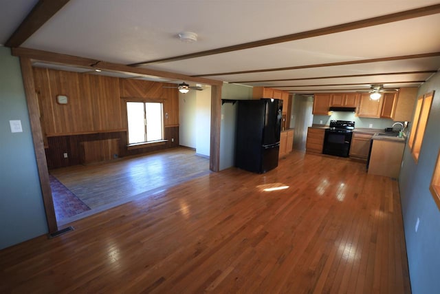 50220 Turkey Ridge Rd, Gays Mills, WI 54631 - kitchen featuring ceiling fan, beam ceiling, open floor plan, and black appliances