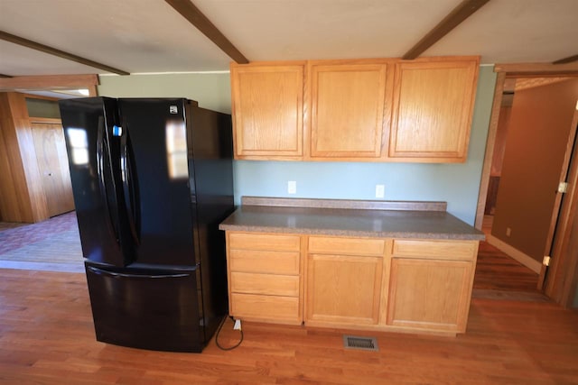 50220 Turkey Ridge Rd, Gays Mills, WI 54631 - kitchen featuring freestanding refrigerator, light wood-style flooring, visible vents, and light brown cabinetry