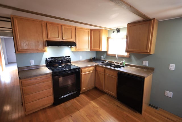 50220 Turkey Ridge Rd, Gays Mills, WI 54631 - kitchen featuring a sink, visible vents, wood finished floors, exhaust hood, and black appliances