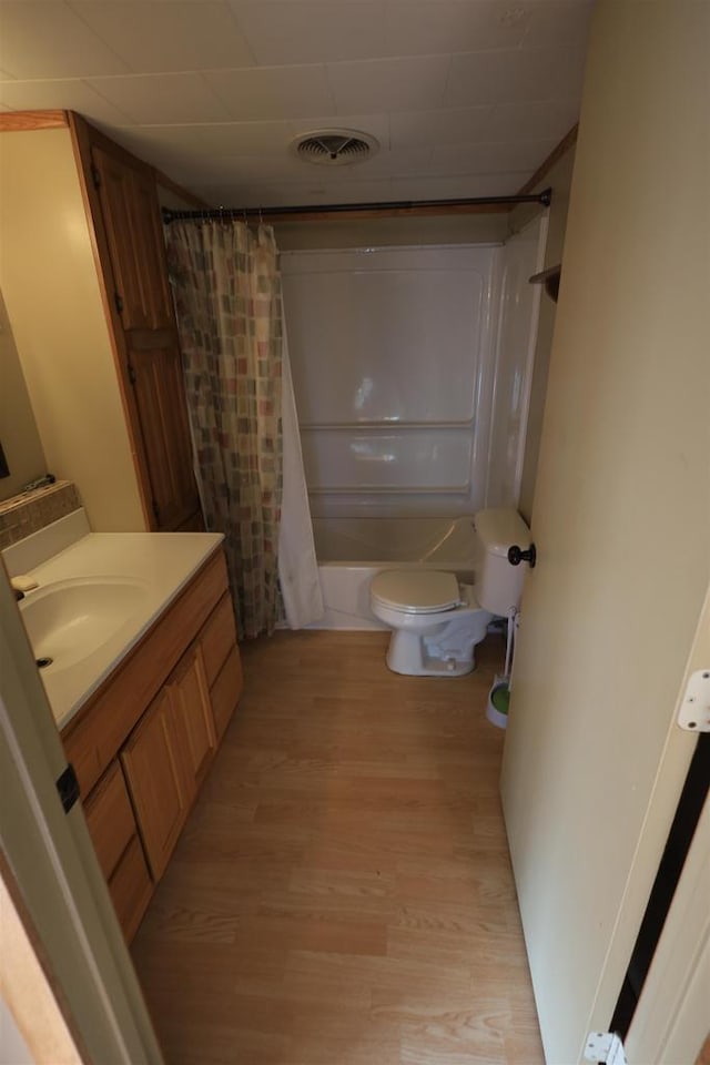 50220 Turkey Ridge Rd, Gays Mills, WI 54631 - full bathroom with toilet, vanity, wood finished floors, and visible vents