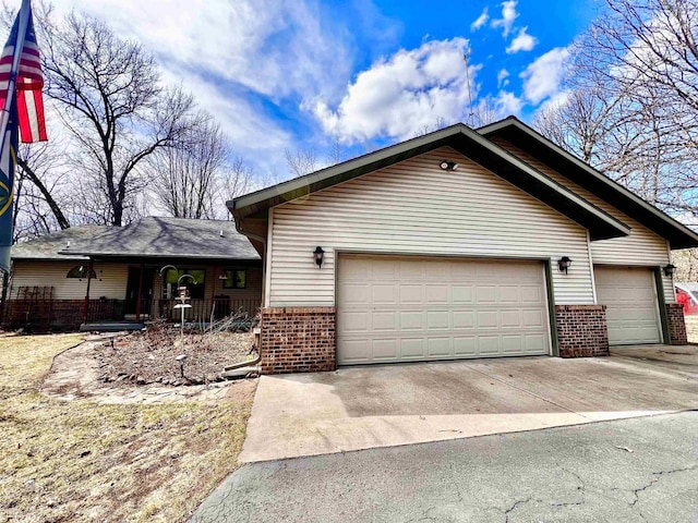 489 Sir Winston Trl, Nekoosa, WI 54457 - single story home featuring brick siding, concrete driveway, and a porch