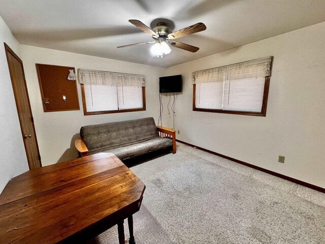 489 Sir Winston Trl, Nekoosa, WI 54457 - carpeted living area featuring a ceiling fan and baseboards