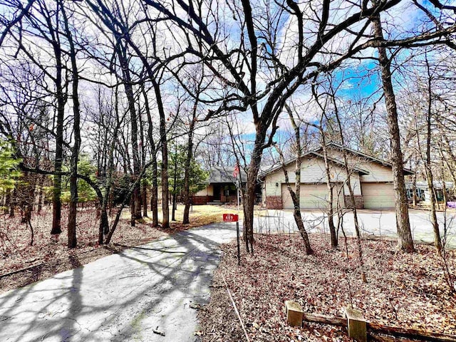 489 Sir Winston Trl, Nekoosa, WI 54457 - single story home with asphalt driveway and brick siding