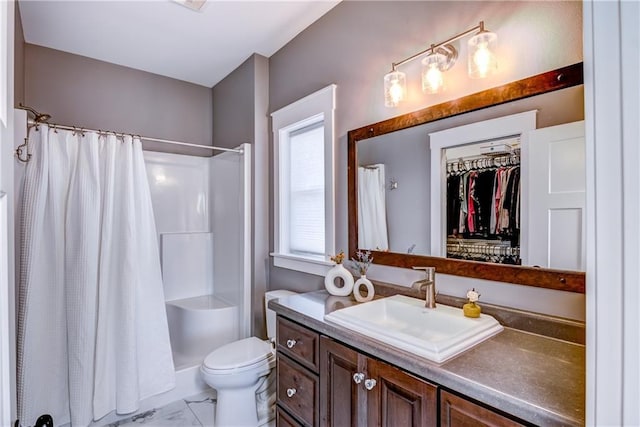 6468 Aspen Ridge Dr, Eau Claire, WI 54703 - bathroom with a shower with shower curtain, marble finish floor, vanity, and toilet