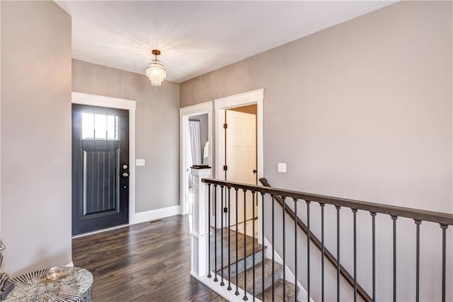 6468 Aspen Ridge Dr, Eau Claire, WI 54703 - entrance foyer with baseboards, a chandelier, dark wood-type flooring, and visible vents