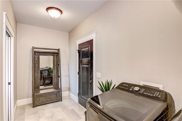 6468 Aspen Ridge Dr, Eau Claire, WI 54703 - clothes washing area with baseboards, washer / clothes dryer, and laundry area