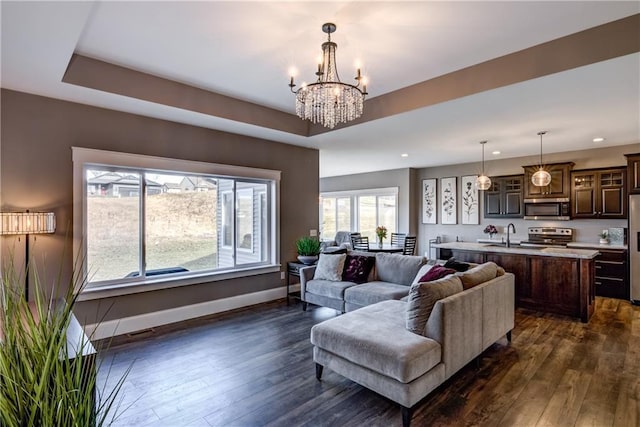 6468 Aspen Ridge Dr, Eau Claire, WI 54703 - living area featuring dark wood-type flooring, baseboards, a notable chandelier, and recessed lighting