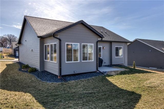 6468 Aspen Ridge Dr, Eau Claire, WI 54703 - back of property with a lawn and roof with shingles