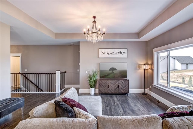6468 Aspen Ridge Dr, Eau Claire, WI 54703 - living area featuring a chandelier, wood finished floors, baseboards, and a tray ceiling