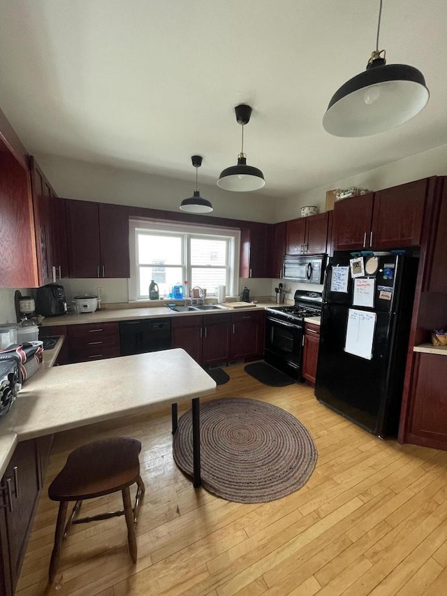 kitchen with black appliances and light countertops