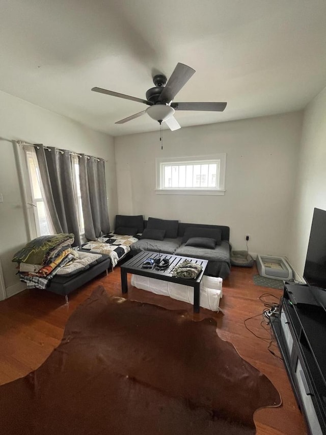 living area featuring wood finished floors and ceiling fan