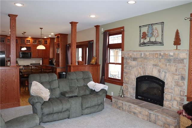 925 Bluff View Cir, Chippewa Falls, WI 54729 - living room featuring a fireplace, recessed lighting, and ornate columns