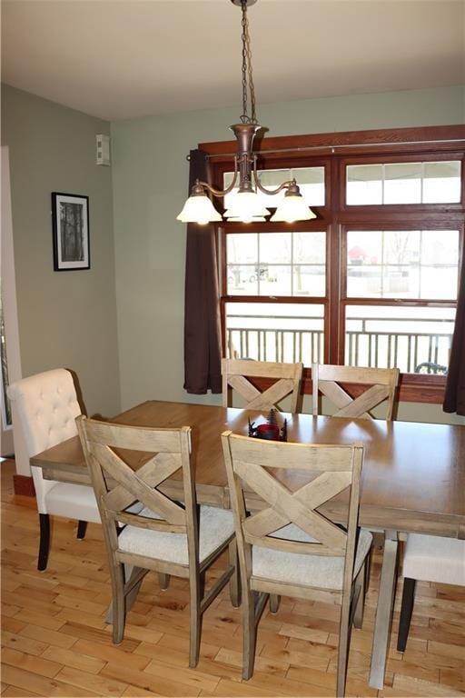 925 Bluff View Cir, Chippewa Falls, WI 54729 - dining area featuring light wood finished floors and a chandelier