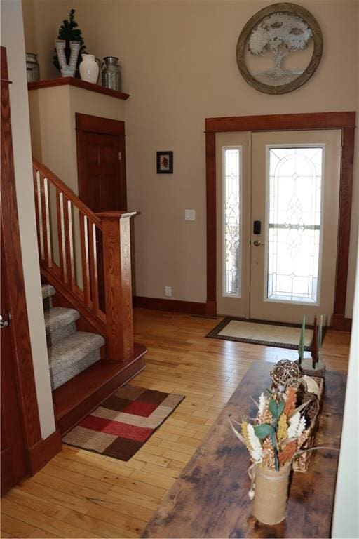 925 Bluff View Cir, Chippewa Falls, WI 54729 - foyer entrance featuring light wood-style floors, baseboards, and stairs