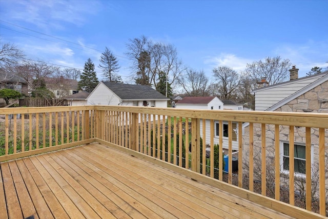 wooden terrace featuring a residential view