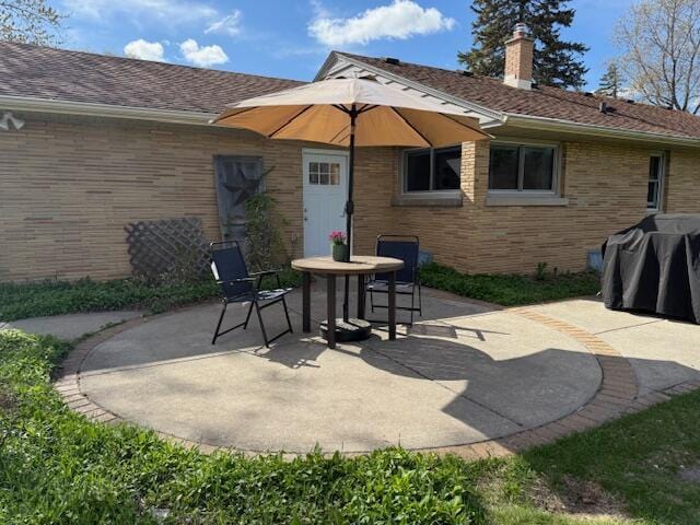 view of patio featuring a grill