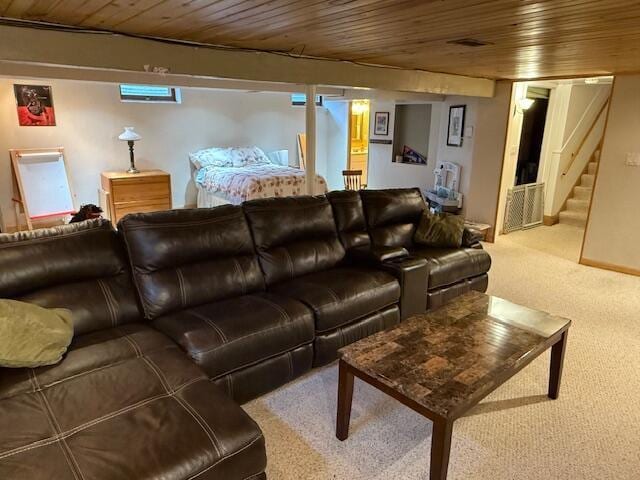 living area with stairway, carpet floors, and wooden ceiling