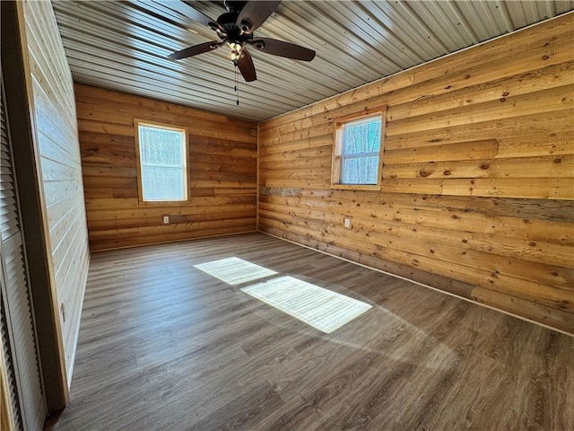 4607N Koeppler Rd, Ojibwa, WI 54862 - empty room with wood finished floors, a ceiling fan, and wooden walls