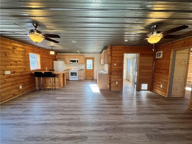 4607N Koeppler Rd, Ojibwa, WI 54862 - unfurnished living room featuring ceiling fan, dark wood-type flooring, and wooden walls