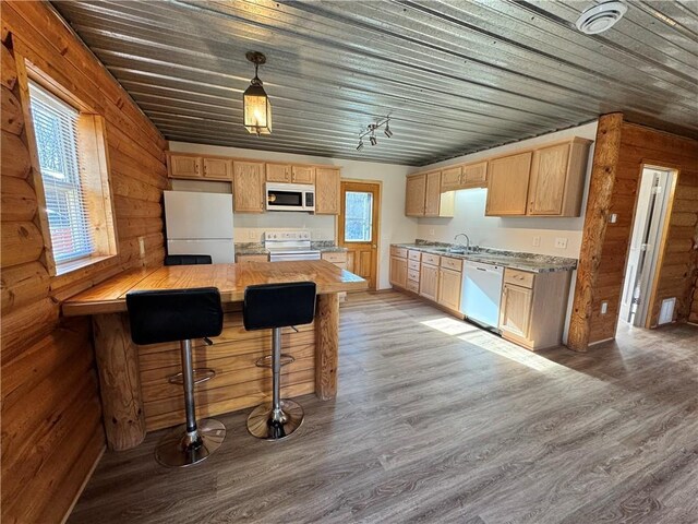 4607N Koeppler Rd, Ojibwa, WI 54862 - kitchen featuring white appliances, light wood finished floors, light countertops, wood walls, and wooden ceiling