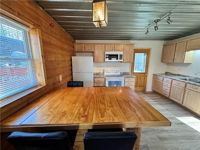 4607N Koeppler Rd, Ojibwa, WI 54862 - kitchen featuring white appliances, a sink, wooden walls, track lighting, and light brown cabinetry