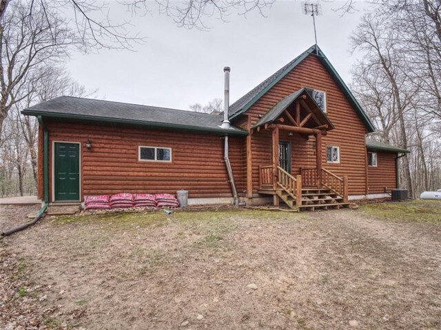 rear view of property featuring central AC unit