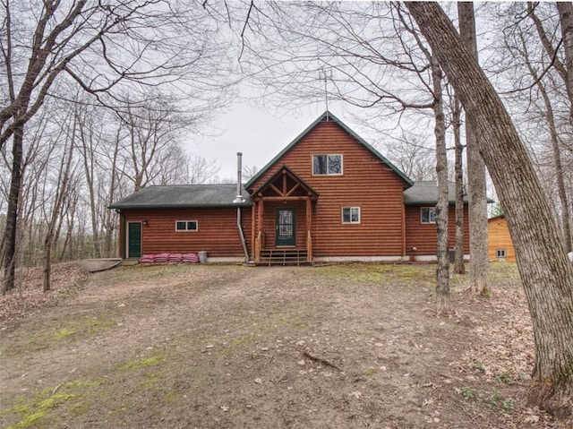 view of front of house with a shingled roof and entry steps