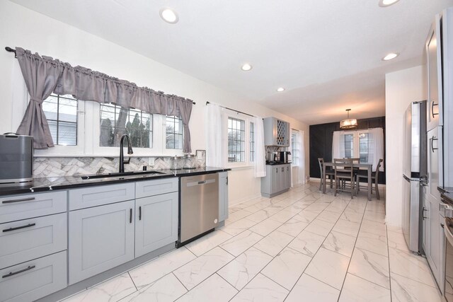 6216 N Santa Monica Blvd, Whitefish Bay, WI 53217 - kitchen with stainless steel dishwasher, marble finish floor, a sink, and recessed lighting