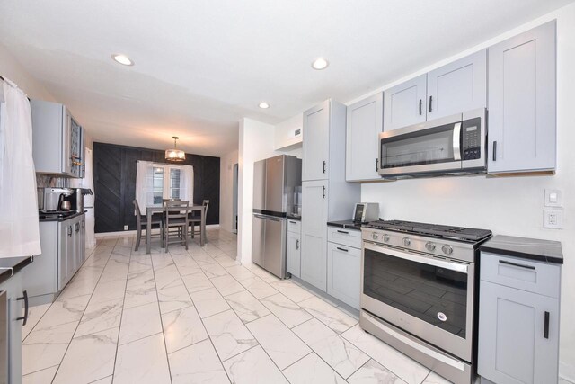 6216 N Santa Monica Blvd, Whitefish Bay, WI 53217 - kitchen featuring recessed lighting, dark countertops, marble finish floor, and stainless steel appliances
