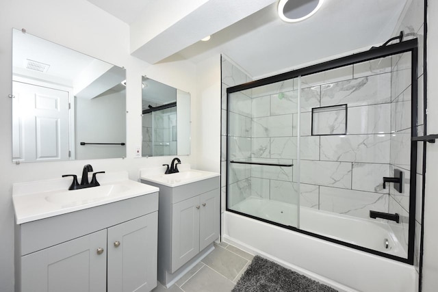 6216 N Santa Monica Blvd, Whitefish Bay, WI 53217 - full bathroom with two vanities, visible vents, a sink, and shower / bath combination with glass door