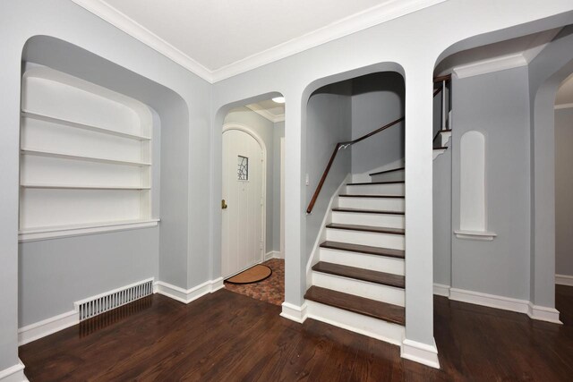 6216 N Santa Monica Blvd, Whitefish Bay, WI 53217 - staircase featuring wood finished floors, arched walkways, baseboards, ornamental molding, and visible vents