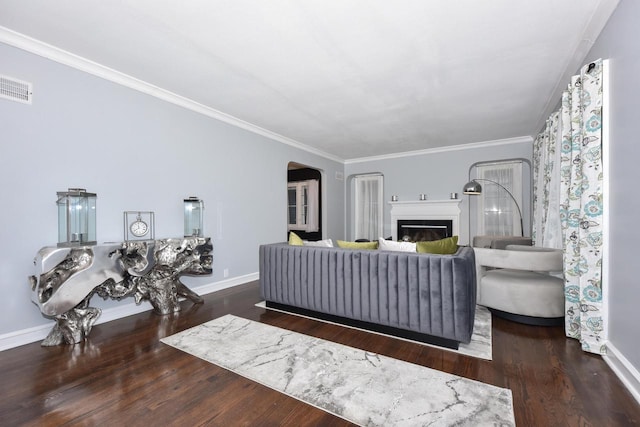 6216 N Santa Monica Blvd, Whitefish Bay, WI 53217 - living room with crown molding, wood finished floors, arched walkways, baseboards, and visible vents