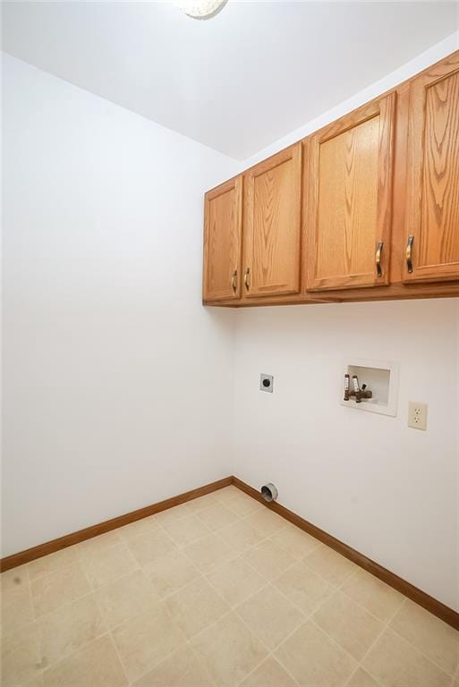 1613 Chumas Dr, Eau Claire, WI 54701 - laundry room with light floors, hookup for a washing machine, baseboards, electric dryer hookup, and cabinet space