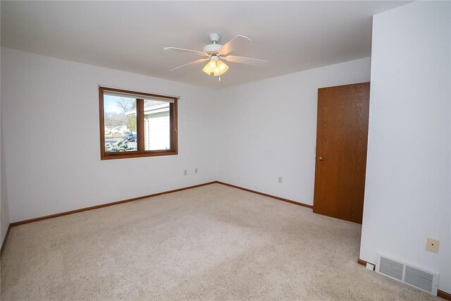 1613 Chumas Dr, Eau Claire, WI 54701 - empty room featuring baseboards, a ceiling fan, visible vents, and carpet floors