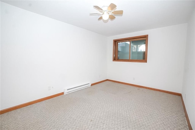 1613 Chumas Dr, Eau Claire, WI 54701 - empty room with baseboard heating, ceiling fan, carpet floors, and baseboards