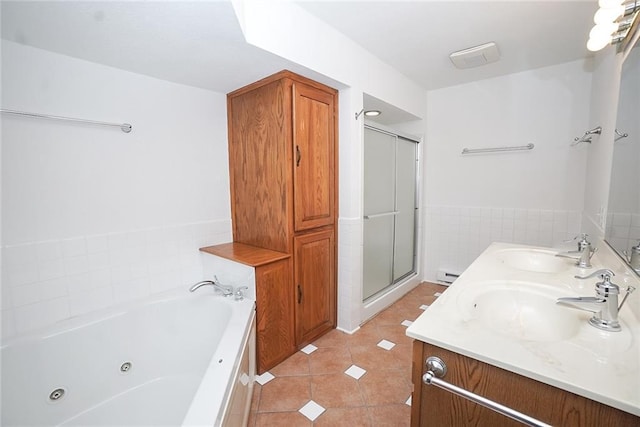 1613 Chumas Dr, Eau Claire, WI 54701 - full bathroom with tile patterned floors, a stall shower, a tub with jets, and a sink